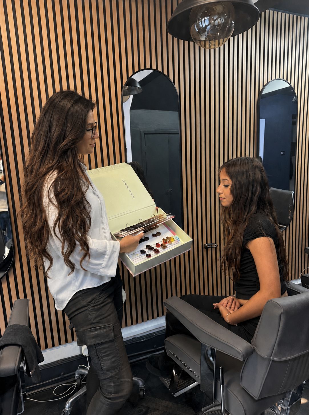 Leo Mancini in a free consultation with a client at Leo & Simon Hair Salon, Eton